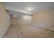 Unfinished basement featuring neutral carpeting and a clean, open layout at 6940 S Uinta St, Centennial, CO 80112