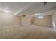 Bright, unfinished basement with neutral carpeting and a clean, open layout at 6940 S Uinta St, Centennial, CO 80112
