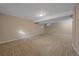 Spacious basement area featuring neutral carpeting and a clean, open layout at 6940 S Uinta St, Centennial, CO 80112
