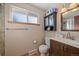 Bathroom with updated vanity, toilet, and linen storage at 6940 S Uinta St, Centennial, CO 80112