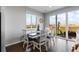 Bright dining room with hardwood floors and sliding glass doors to the back patio at 27491 E 10Th Dr, Aurora, CO 80018