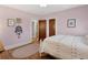Comfortable bedroom featuring hardwood floors, soft pink walls, and decorative accents at 2591 Albion St, Denver, CO 80207