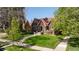 Charming home with beautiful landscaping and inviting curb appeal at 2591 Albion St, Denver, CO 80207