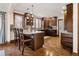 Spacious kitchen with wooden cabinets, granite countertops, stainless steel appliances, and a breakfast bar at 2591 Albion St, Denver, CO 80207