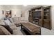 Spacious living room with large sectional sofa and entertainment center at 2591 Albion St, Denver, CO 80207