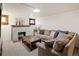 Cozy living room features a brick fireplace and comfortable sofa at 2591 Albion St, Denver, CO 80207