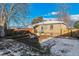 Brick home with a deck, fire pit and fenced backyard at 3151 S Corona St, Englewood, CO 80113