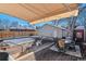 Deck with seating area, fire pit, and detached garage at 3151 S Corona St, Englewood, CO 80113