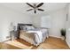 Bright bedroom with hardwood floors and ceiling fan at 3151 S Corona St, Englewood, CO 80113