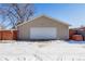 Tan detached garage in a snowy yard at 3151 S Corona St, Englewood, CO 80113