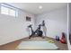 Basement home gym with Peloton bike and weights at 3151 S Corona St, Englewood, CO 80113