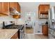 Well-equipped kitchen with stainless steel appliances and wood cabinets at 3151 S Corona St, Englewood, CO 80113