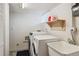 Basement laundry room with washer, dryer, and utility sink at 3151 S Corona St, Englewood, CO 80113