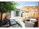 Charming backyard with patio, artificial turf, lounge seating, and privacy fence perfect for relaxing and entertaining at 480 S Grant St, Denver, CO 80209
