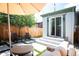 Charming backyard with patio, artificial turf, lounge seating, and privacy fence perfect for relaxing and entertaining at 480 S Grant St, Denver, CO 80209