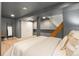Finished basement bedroom featuring neutral decor, hardwood floors, and a finished ceiling at 480 S Grant St, Denver, CO 80209