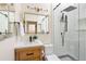 Modern bathroom with a glass-enclosed shower, sleek fixtures, and a wood vanity at 480 S Grant St, Denver, CO 80209