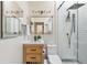 Modern bathroom with stylish vanity, sleek fixtures, and a glass-enclosed shower, combining elegance and functionality at 480 S Grant St, Denver, CO 80209