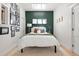 Stylish bedroom with accent wall, skylight, and modern decor, offering a serene and relaxing space at 480 S Grant St, Denver, CO 80209
