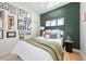 Charming bedroom features a skylight, gallery wall, and a comfortable bed, creating a cozy retreat at 480 S Grant St, Denver, CO 80209