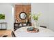 Contemporary dining area boasts a round marble table, stylish decor, and a chic cabinet, ideal for modern living at 480 S Grant St, Denver, CO 80209