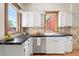 Bright kitchen with white cabinetry, granite countertops, and natural light, creating a clean and inviting space at 480 S Grant St, Denver, CO 80209