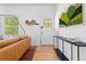 Stylish living area with modern furnishings, hardwood floors, and a well-lit entryway at 480 S Grant St, Denver, CO 80209