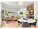 Inviting living room with hardwood floors, stylish decor, and exposed brick accent wall at 480 S Grant St, Denver, CO 80209