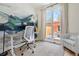 Bright office space with a large mural, sliding door access to the backyard and neutral decor at 480 S Grant St, Denver, CO 80209