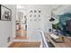 Bright office leading to the kitchen, featuring hardwood floors, and neutral decor with a modern mural at 480 S Grant St, Denver, CO 80209
