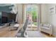 Comfortable office space featuring neutral decor, a sliding door to the backyard, and lots of natural light at 480 S Grant St, Denver, CO 80209