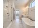 Bathroom with large, glass-door shower and soaking tub at 2702 E 103Rd Ave, Thornton, CO 80229