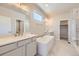 Modern bathroom with double vanity, soaking tub, and glass-enclosed shower at 2702 E 103Rd Ave, Thornton, CO 80229
