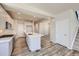Modern kitchen featuring a central island with quartz countertops, stainless appliances, and open layout at 2702 E 103Rd Ave, Thornton, CO 80229