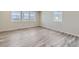 Bright living area with wood floors, natural light, and modern interior finishes at 2702 E 103Rd Ave, Thornton, CO 80229