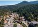 Overhead view of a charming town nestled amidst lush forests and majestic mountains at 34075 Grouse Ln, Evergreen, CO 80439
