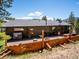 Expansive backyard deck features outdoor seating, perfect for relaxation and entertaining at 34075 Grouse Ln, Evergreen, CO 80439
