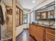 Bathroom featuring stone shower, vessel sinks, and hardwood floors, offering a luxurious retreat at 34075 Grouse Ln, Evergreen, CO 80439
