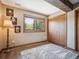 Bedroom featuring a large window with natural lighting, a large closet, and a cozy rug on the floor at 34075 Grouse Ln, Evergreen, CO 80439