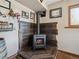 Modern fireplace with wood accent wall, complementing decor, and displays create a warm, inviting space at 34075 Grouse Ln, Evergreen, CO 80439