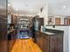 Modern kitchen with stainless steel appliances, black granite countertops, and warm wood floors at 34075 Grouse Ln, Evergreen, CO 80439
