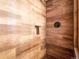 Tiled shower featuring a built-in shelf and a bronze shower head at 34075 Grouse Ln, Evergreen, CO 80439