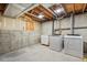 Unfinished basement laundry area with washer and dryer, perfect for customization at 13701 Yank Way, Arvada, CO 80004