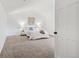Spacious bedroom with a vaulted ceiling, neutral carpet, and a large window at 13701 Yank Way, Arvada, CO 80004