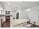 Bright kitchen features white cabinets, stainless appliances, and a center island with seating at 13701 Yank Way, Arvada, CO 80004