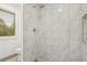 Modern walk-in shower features sleek tile, a rainfall showerhead, and a glass enclosure for a spa-like feel at 13701 Yank Way, Arvada, CO 80004