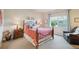 Inviting bedroom with large window, a recliner and wood furnishings at 3595 E 124Th Pl, Thornton, CO 80241