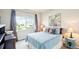 This comfortable bedroom features a picture window, drapes and stylish decor at 3595 E 124Th Pl, Thornton, CO 80241