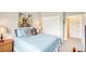 This bedroom offers a decorative painting, closet and ensuite access at 3595 E 124Th Pl, Thornton, CO 80241