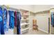 Walk-in closet with clothing racks, shelves, a chair, and mirror at 3595 E 124Th Pl, Thornton, CO 80241